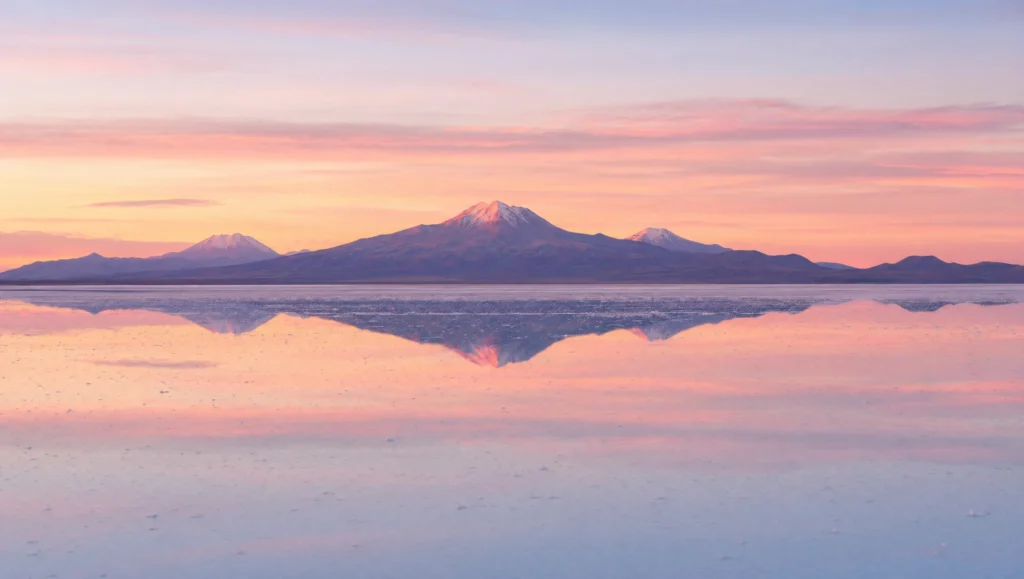 Salar de Uyuni salt flats stretching to the horizon under a wide sky, Bolivia