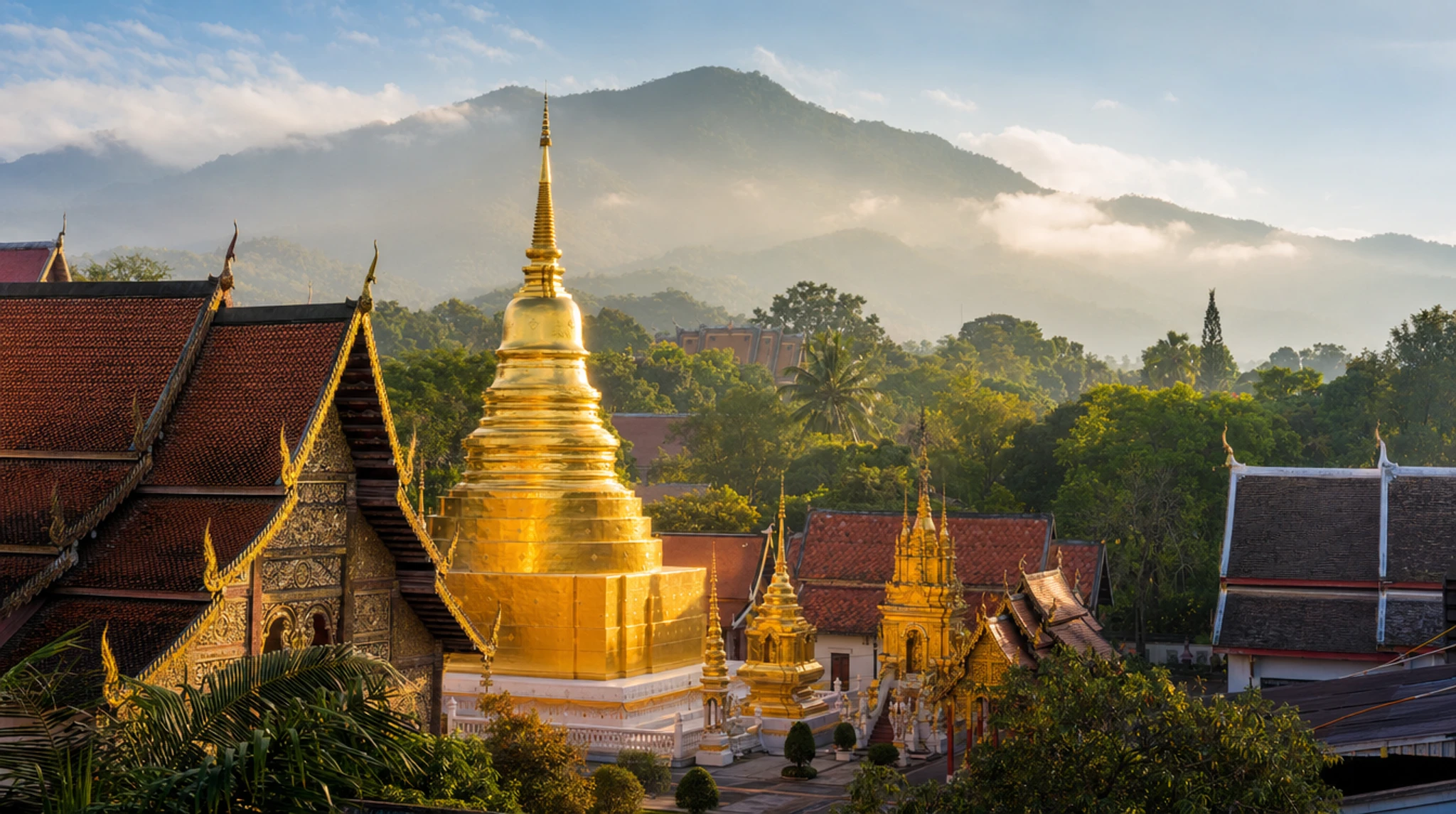 Wat Phra Singh temple gilded chedi and prayer hall in old Chiang Mai, Thailand