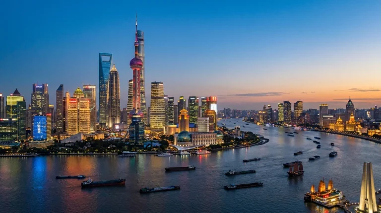 Shanghai, China — the Bund and Pudong skyline with the Oriental Pearl Tower at dusk