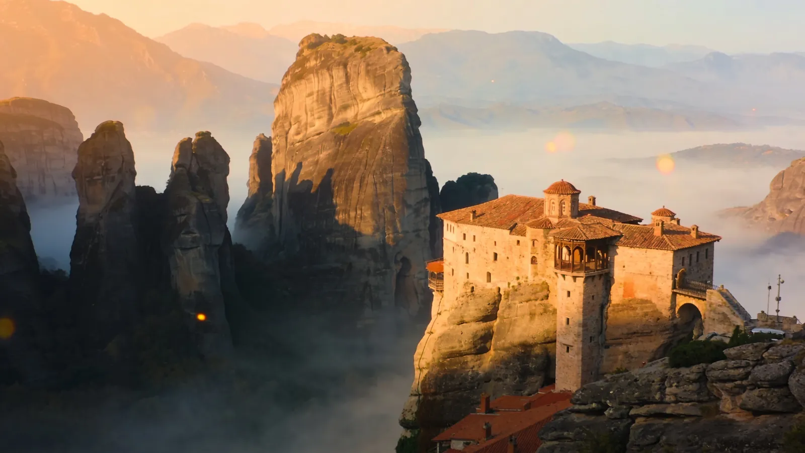 Meteora monastery perched on a rock pillar at sunrise