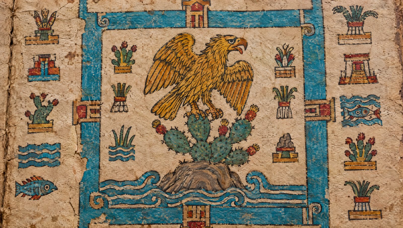 A painted codex page on bark paper showing a golden eagle perched on a nopal cactus above blue water, surrounded by glyphs
